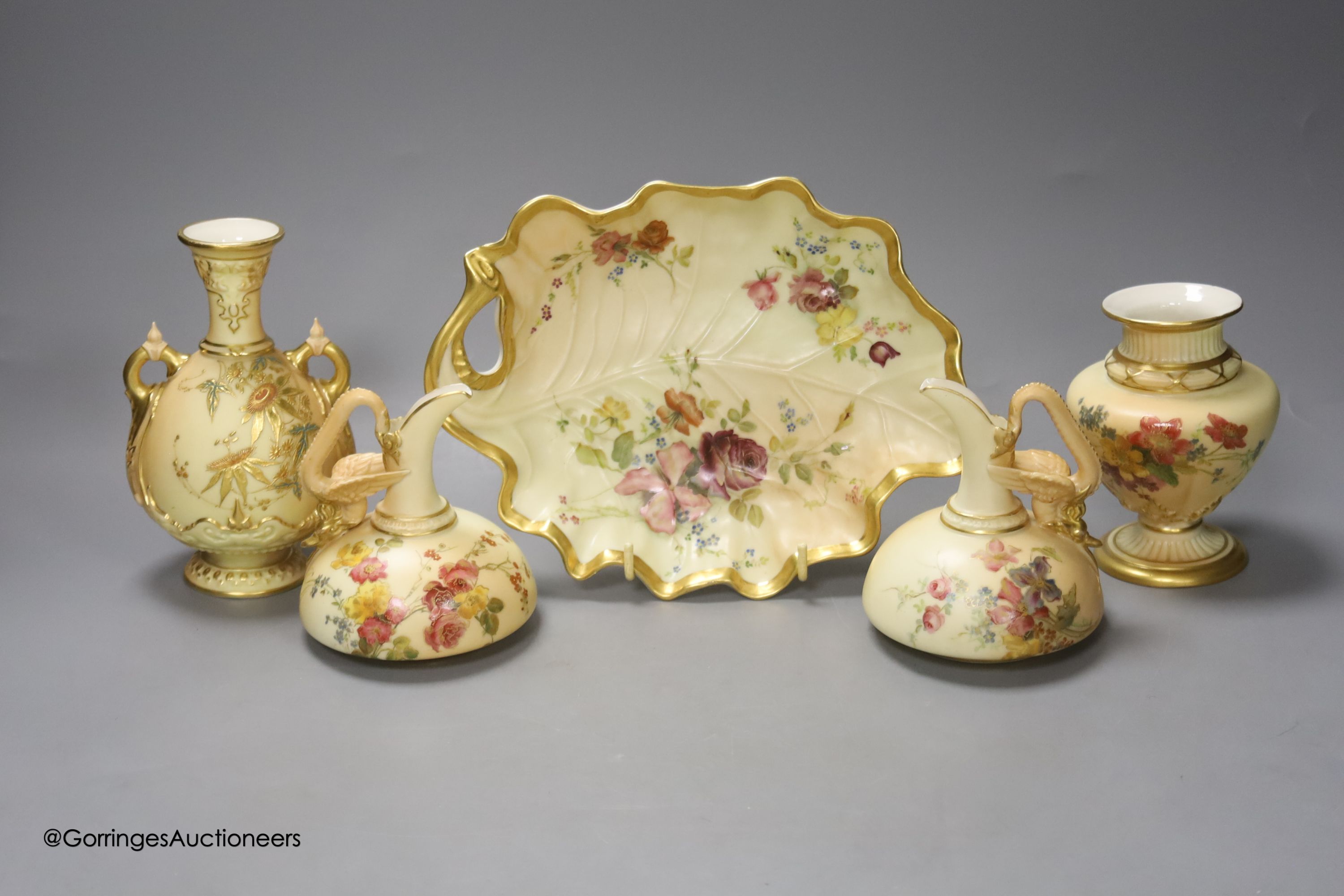 A Royal Worcester blush leaf dish, a pair of ewers, a two handled vase and another